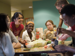 several UMBC students gathering around a table
