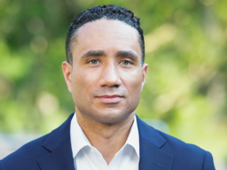 headshot of man in white shirt and blue blazer