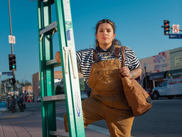 Artist Johanna Turuño poses with a ladder.