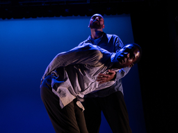 Dancers Baye and Asa performing on stage.