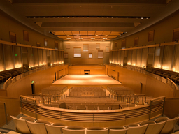 A view of a concert hall, looking toward the stage.