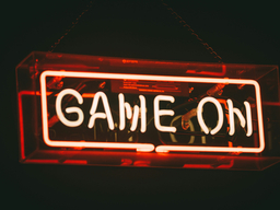 GAME ON Orange Neon sign lit up against a dark background